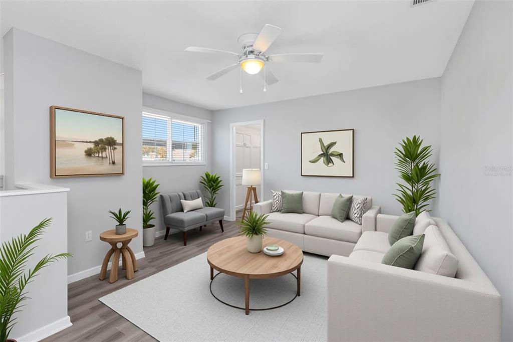 6520 Thicket Trail New Port Richey, FL 34653 - Photo 33 of 43 a living room with furniture and a potted plant