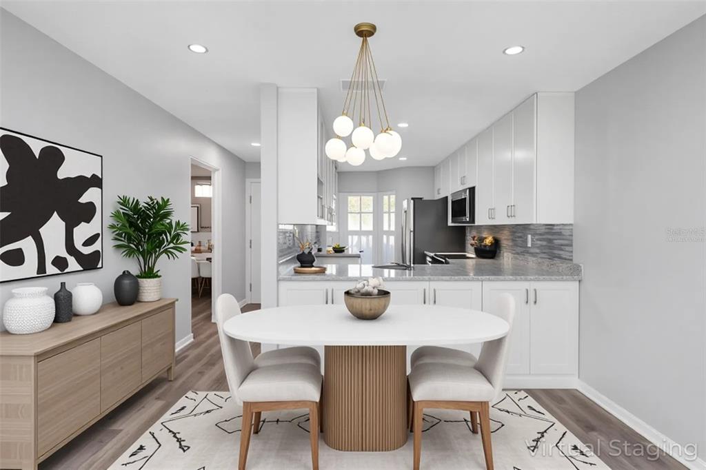 6520 Thicket Trail New Port Richey, FL 34653 - Photo 4 of 43 a view of a dining room with furniture and chandelier