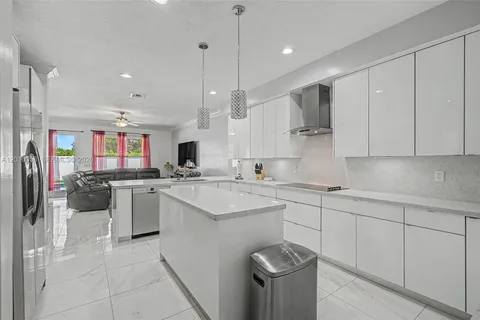 a kitchen with lots of counter top space and appliances