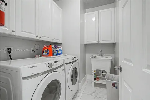 a utility room with dryer and washer