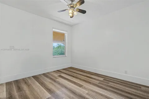 a view of room with window and ceiling fan