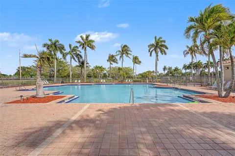 a view of swimming pool with lounge chair