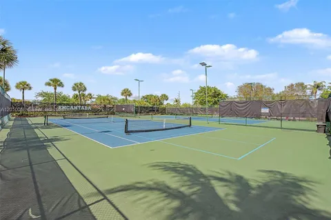 a view of an outdoor space and tennis court