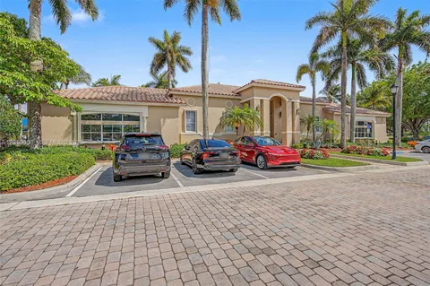 a car parked in front of house with a yard