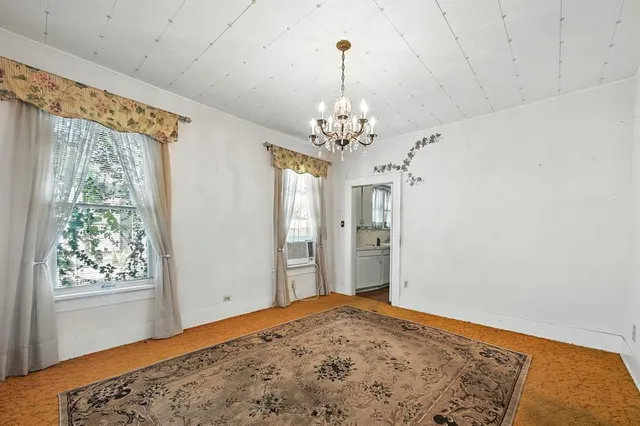 a view of a bedroom and window