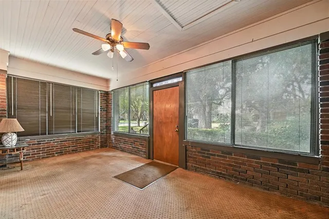 a view of empty room with floor to ceiling window