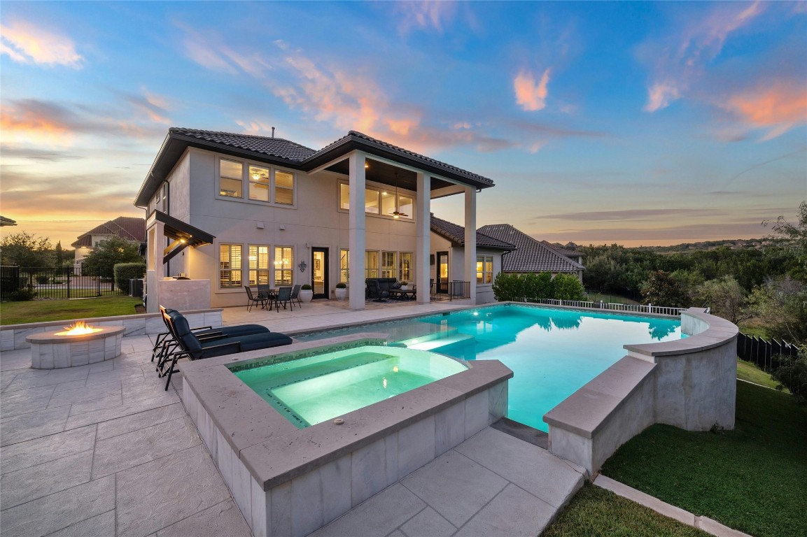 1400 Morning Moon Circle Austin, TX 78732 - Photo 1 of 1 a front view of a house with swimming pool having outdoor seating
