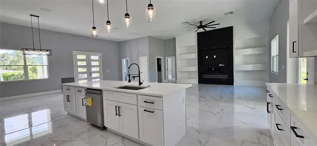 a kitchen with a sink and cabinets