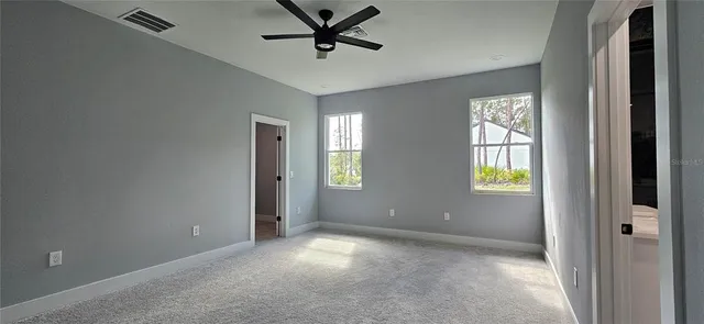 a view of empty room with windows