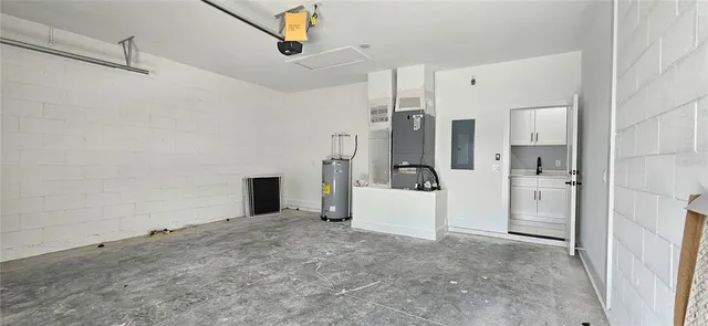 a view of a kitchen and an empty room