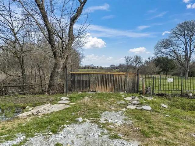 a garden with wooden fence
