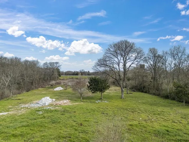 a view of a lake with a yard