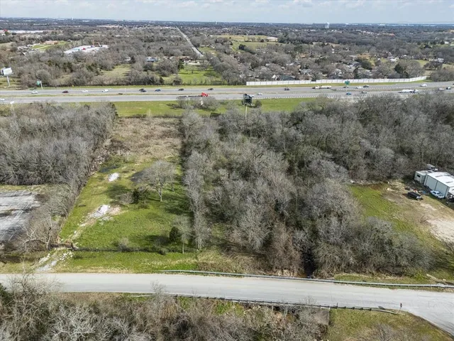 a view of a lake with a yard