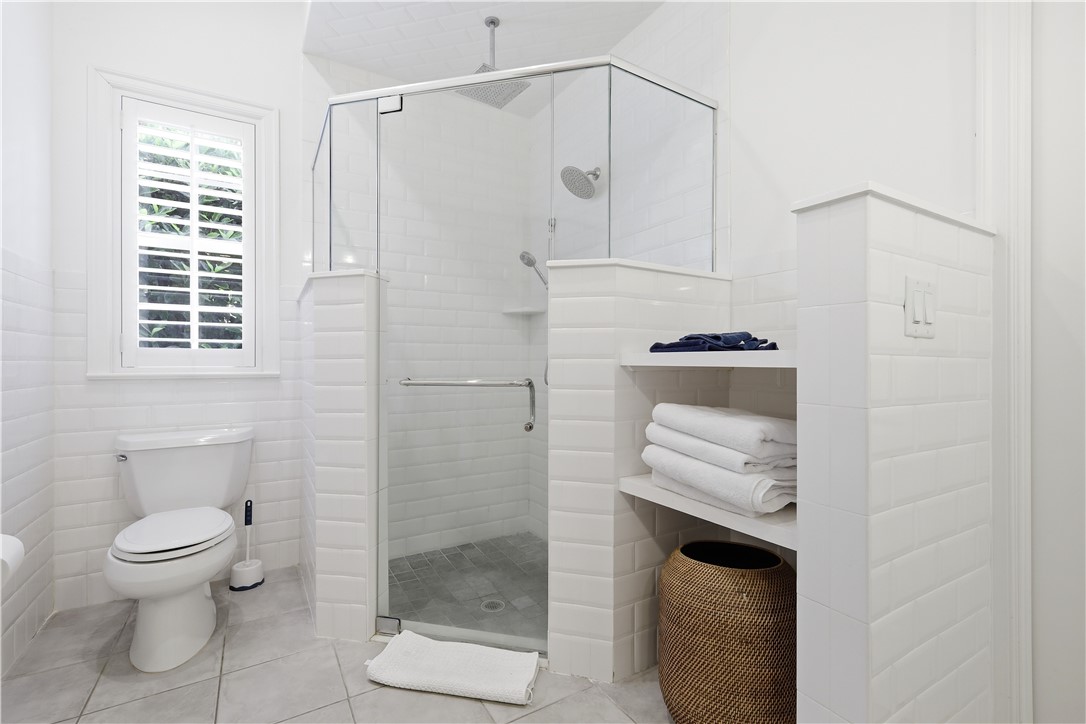 2116 Cavalla Road Vero Beach, FL 32963 - Photo 10 of 23 a bathroom with a shower a toilet and a window