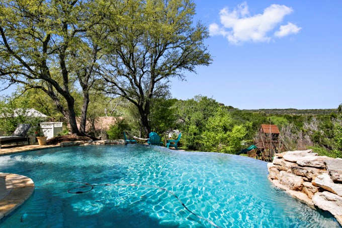 a backyard of a house with lots of green space