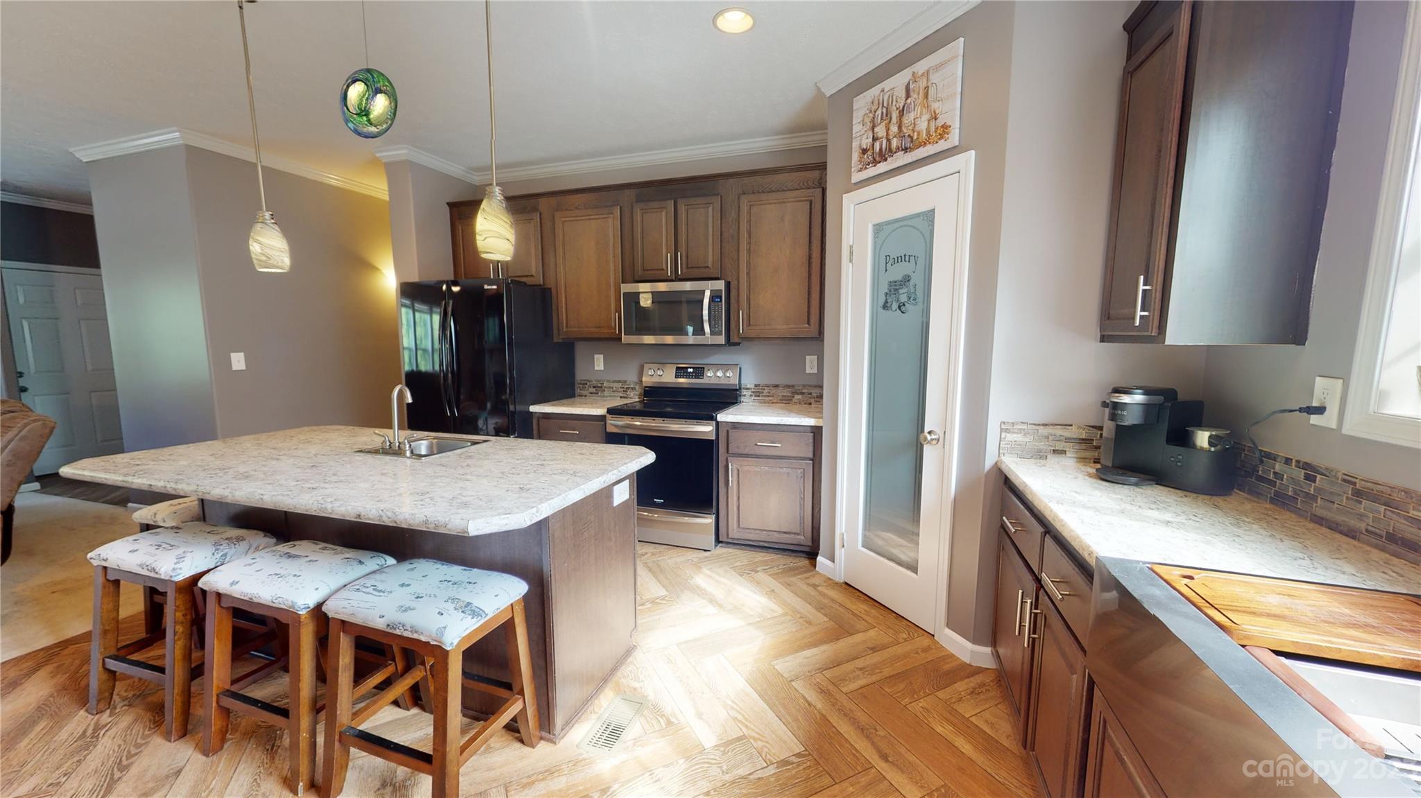 210 Mooseheart Ridge Marion, NC 28752 - Photo 1 of 37 a kitchen with granite countertop a sink stove and refrigerator