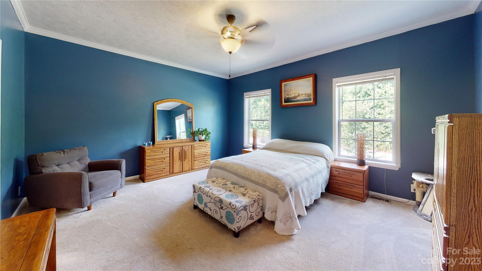 210 Mooseheart Ridge Marion, NC 28752 - Photo 13 of 37 a spacious bedroom with a bed and a couch