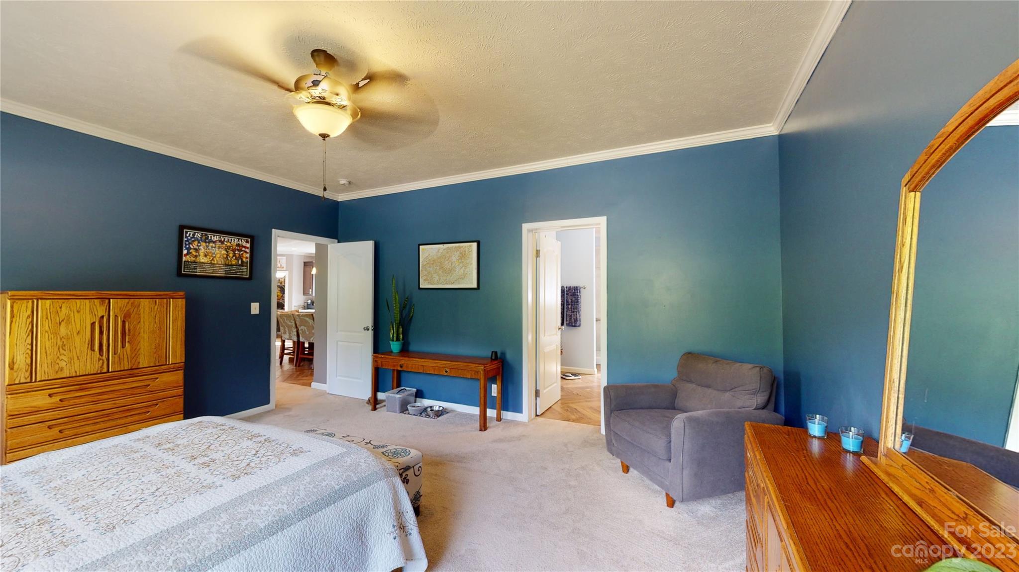 210 Mooseheart Ridge Marion, NC 28752 - Photo 14 of 37 a bedroom with a bed and a chandelier