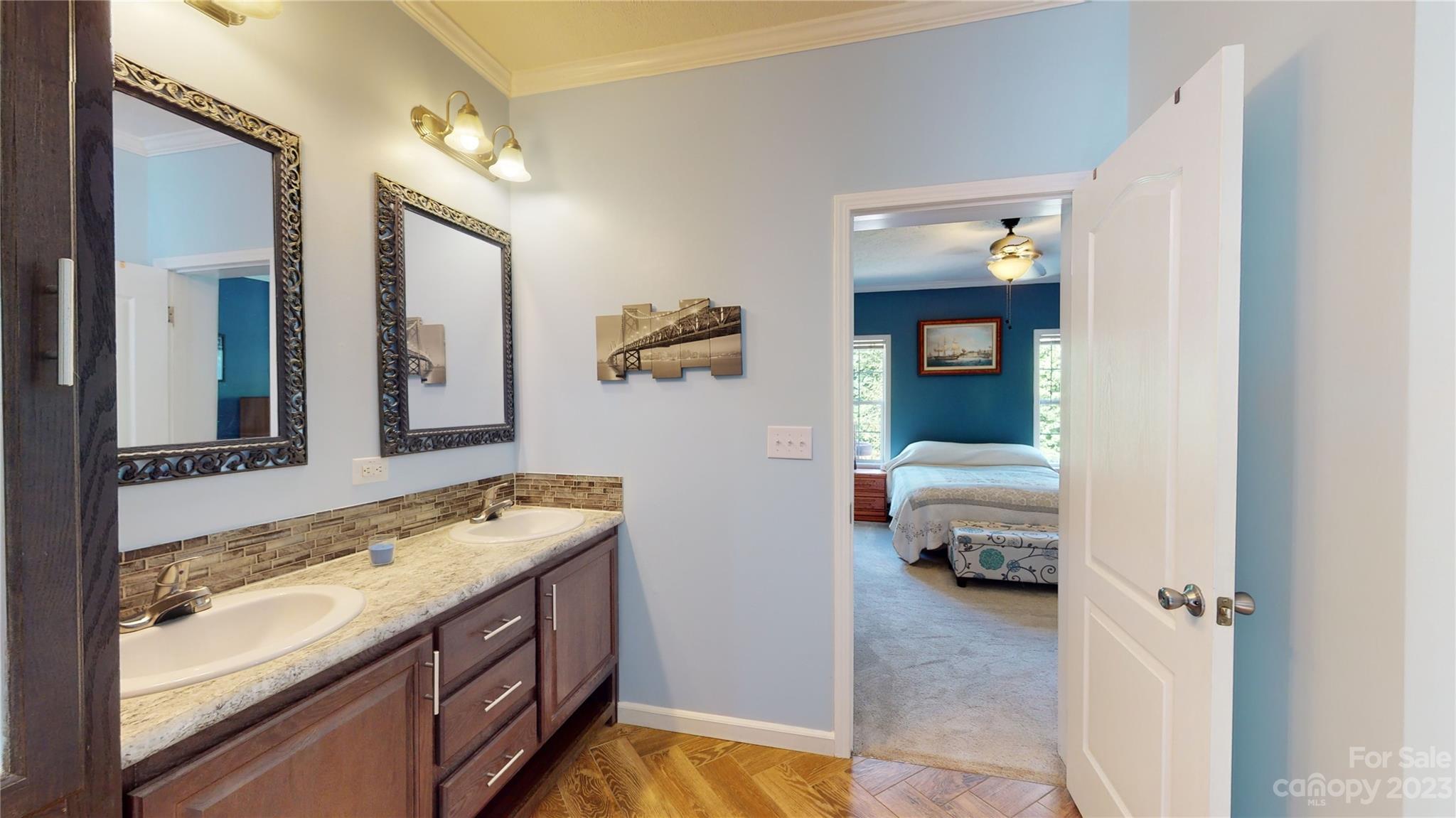210 Mooseheart Ridge Marion, NC 28752 - Photo 17 of 37 a en suite bathroom with a granite countertop sink and a mirror