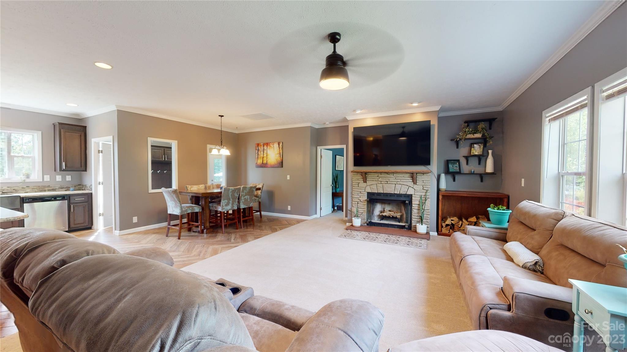 210 Mooseheart Ridge Marion, NC 28752 - Photo 2 of 37 a living room with furniture a fireplace and a flat screen tv