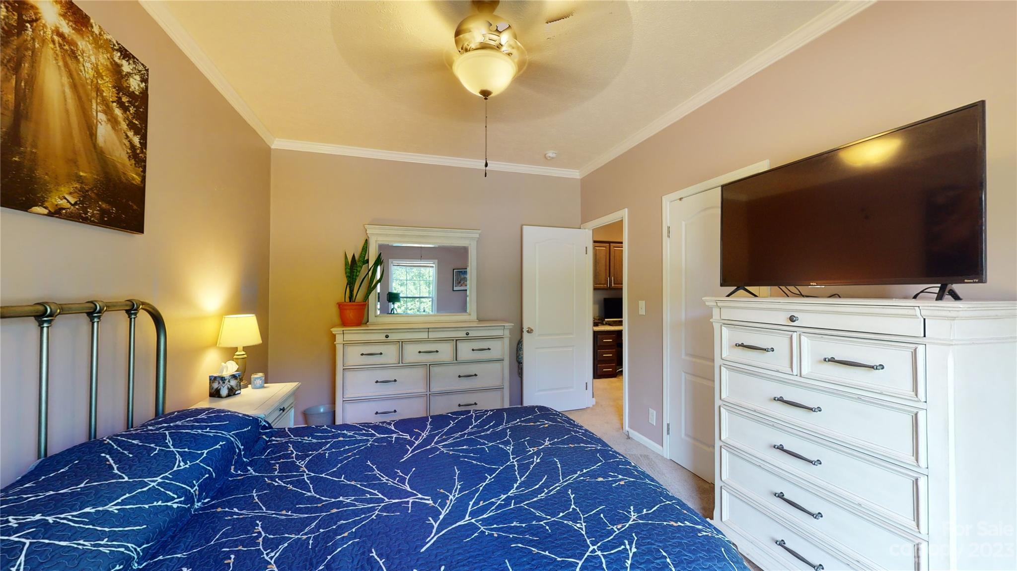 210 Mooseheart Ridge Marion, NC 28752 - Photo 22 of 37 a bedroom with a bed and a flat screen tv