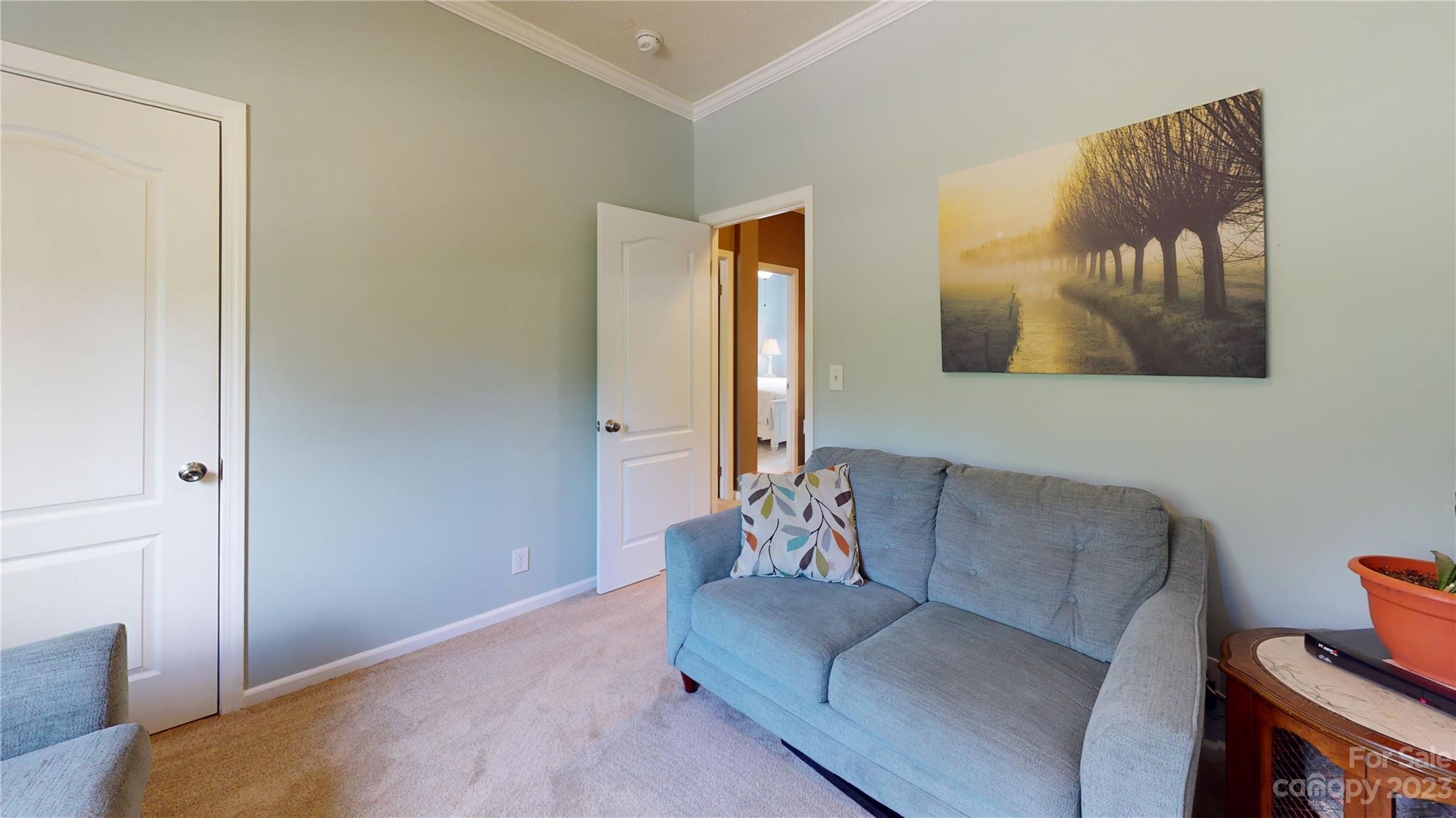 210 Mooseheart Ridge Marion, NC 28752 - Photo 23 of 37 a living room with furniture and a window