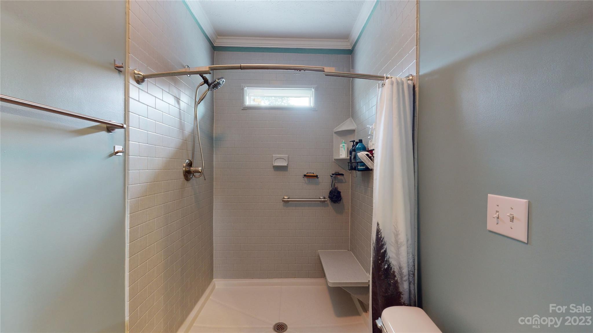 210 Mooseheart Ridge Marion, NC 28752 - Photo 25 of 37 a bathroom with a shower and toilet