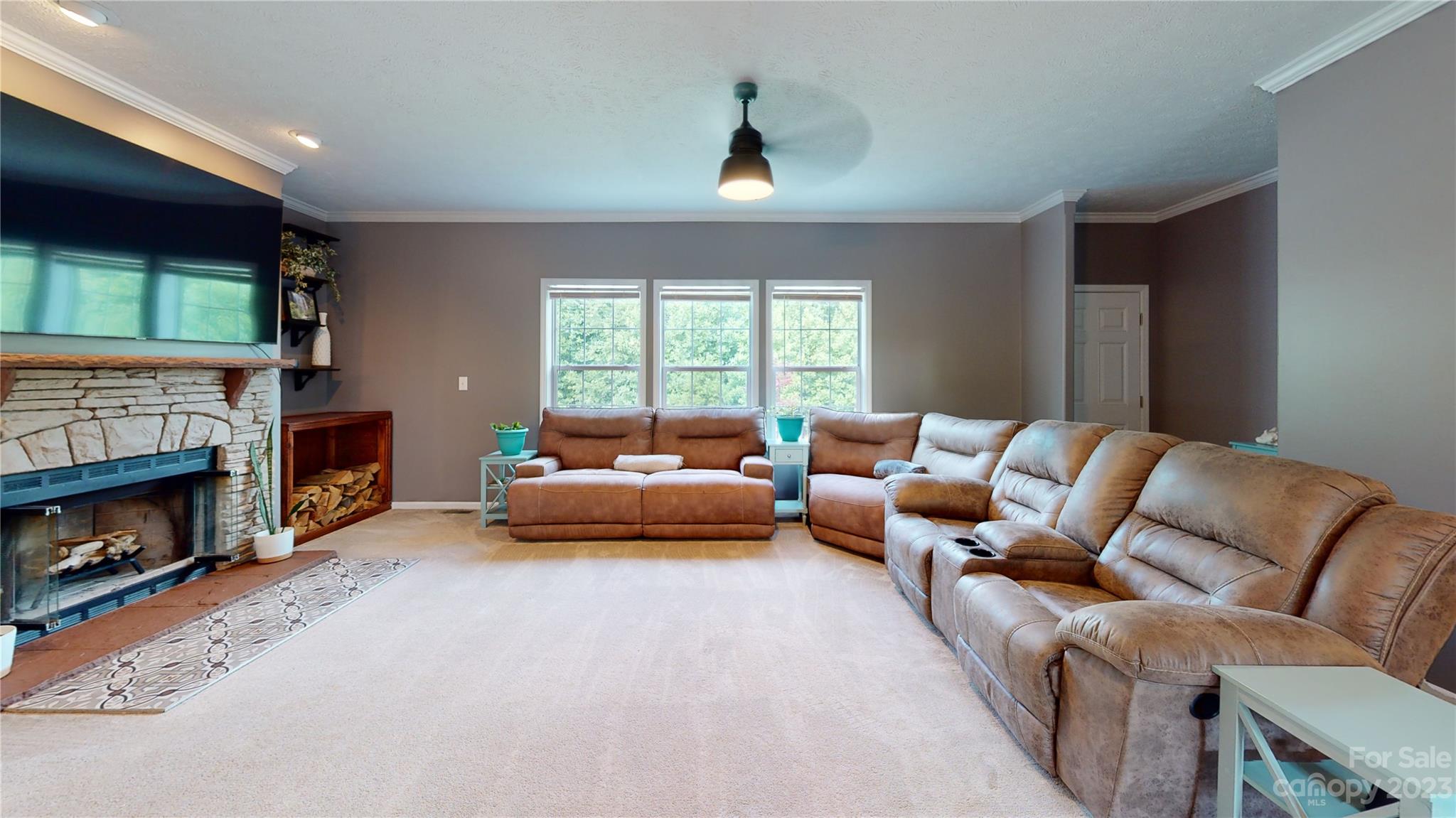 210 Mooseheart Ridge Marion, NC 28752 - Photo 3 of 37 a living room with furniture and a fireplace