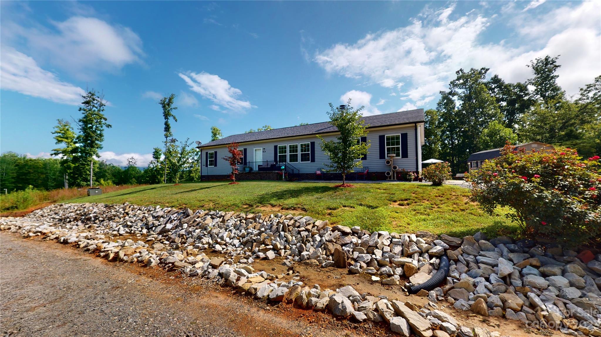 210 Mooseheart Ridge Marion, NC 28752 - Photo 31 of 37 a view of a house with a yard