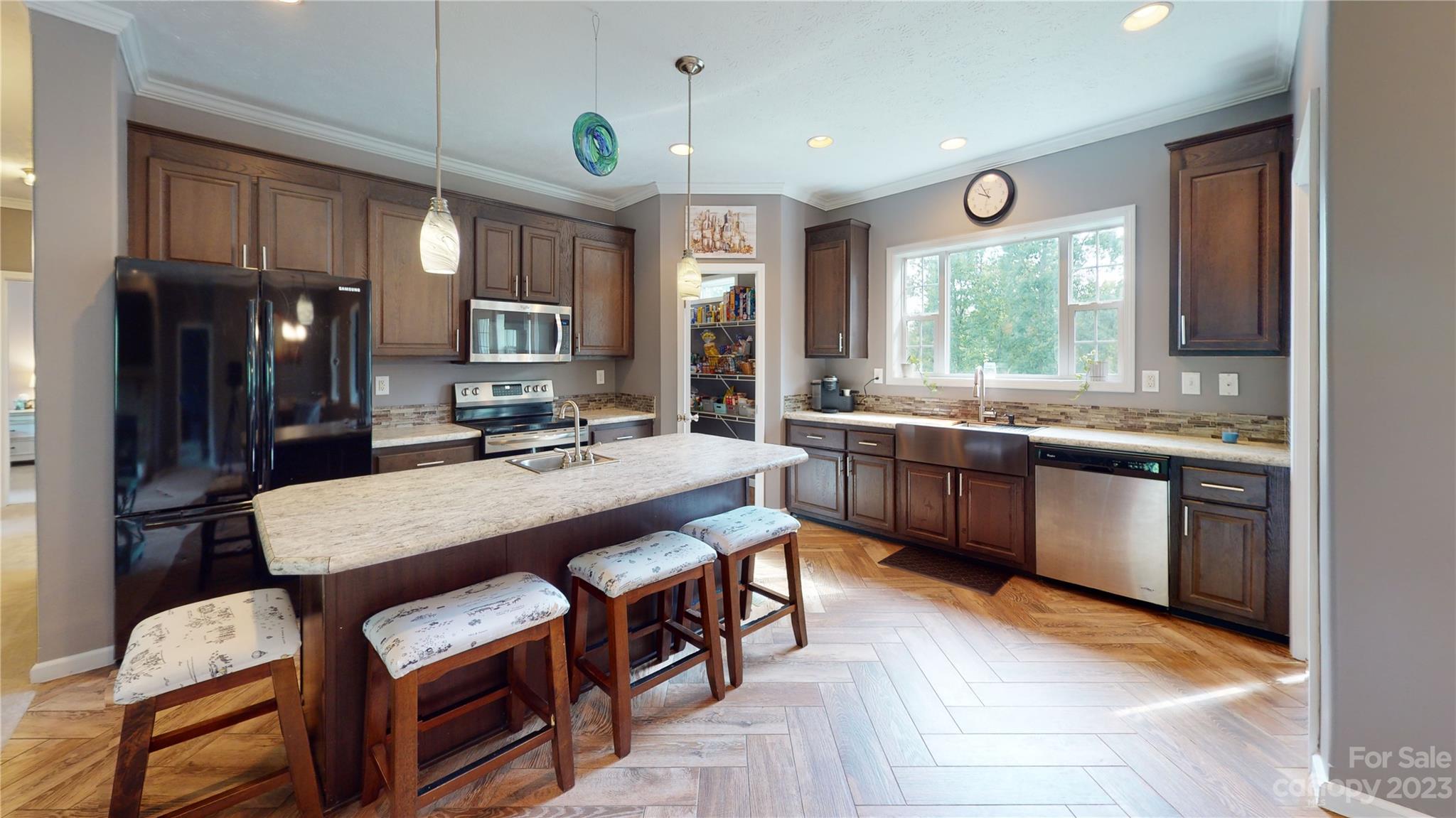 210 Mooseheart Ridge Marion, NC 28752 - Photo 8 of 37 a kitchen with stainless steel appliances granite countertop a stove a refrigerator a sink dishwasher with a dining table and chairs