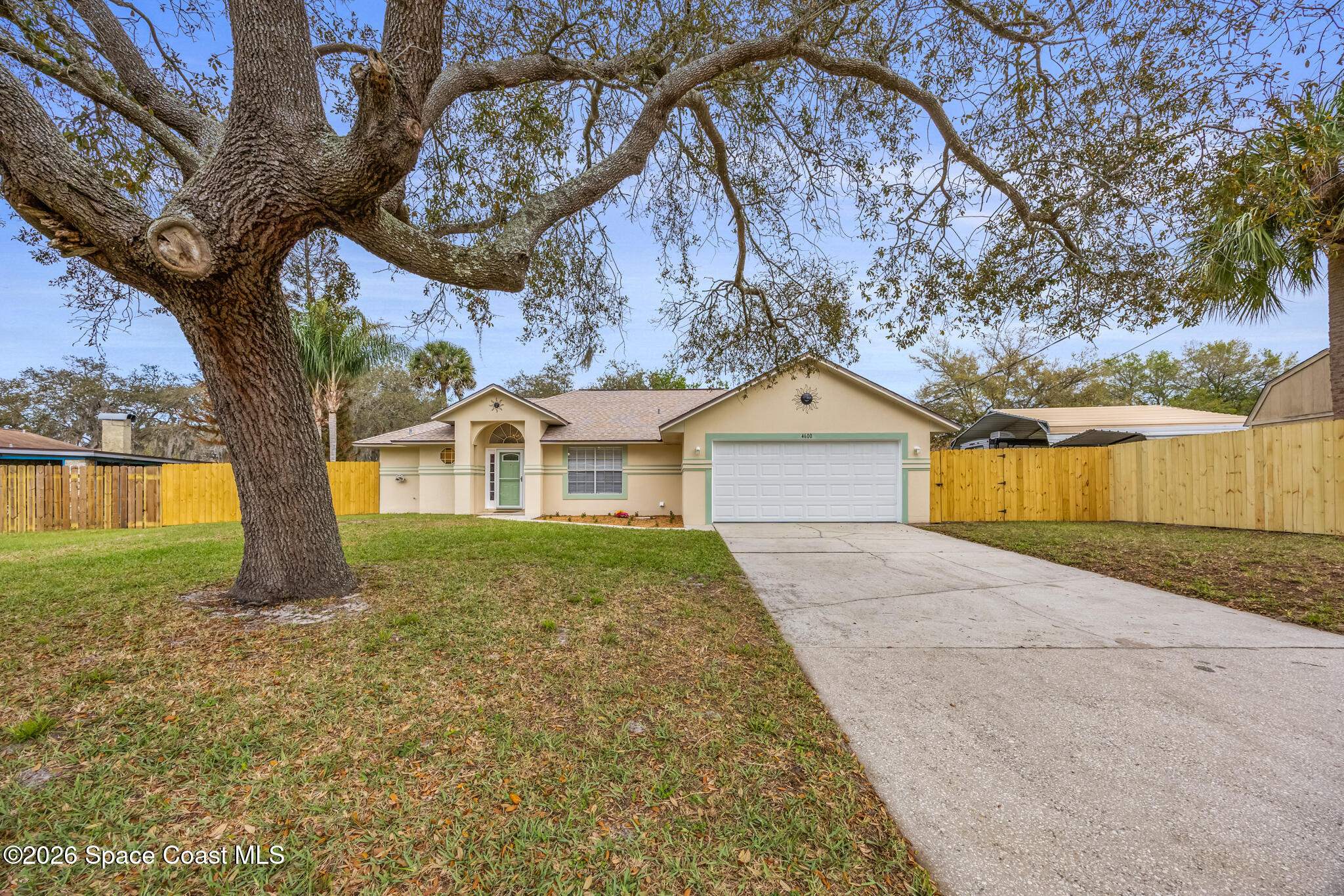 4600 Comfort Street Cocoa, FL 32927 - Photo 1 of 29 a front view of a house with garden