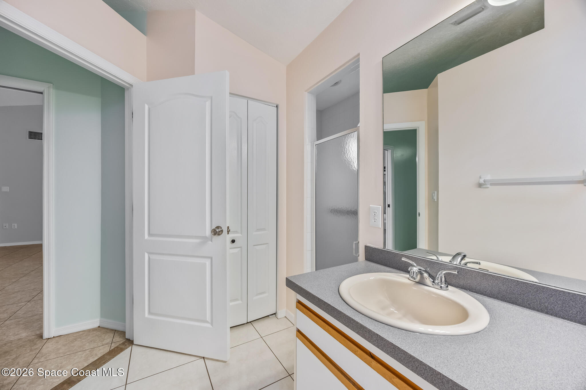 4600 Comfort Street Cocoa, FL 32927 - Photo 15 of 29 a bathroom with a sink and a mirror