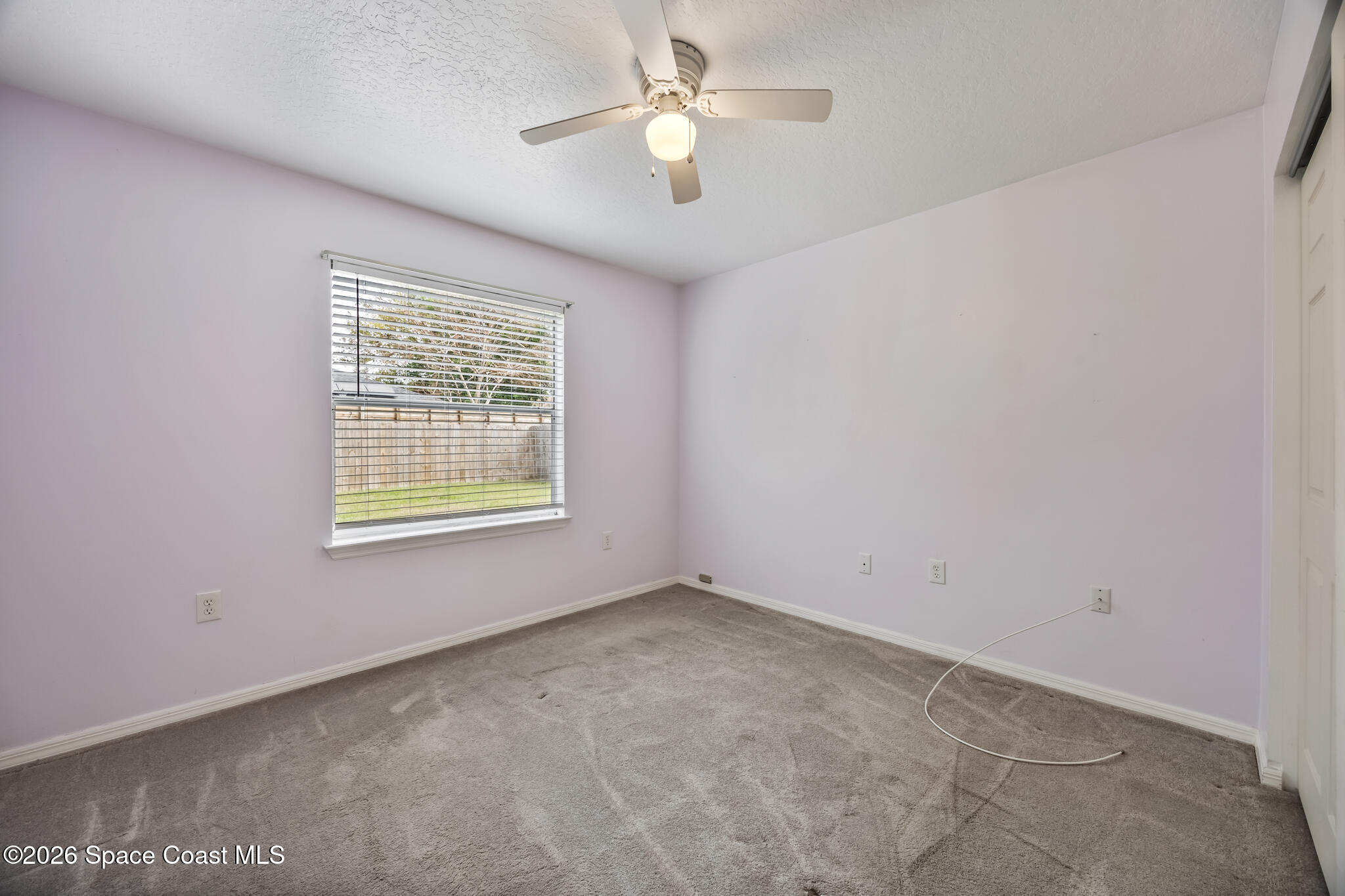4600 Comfort Street Cocoa, FL 32927 - Photo 20 of 29 an empty room with a window and a fan