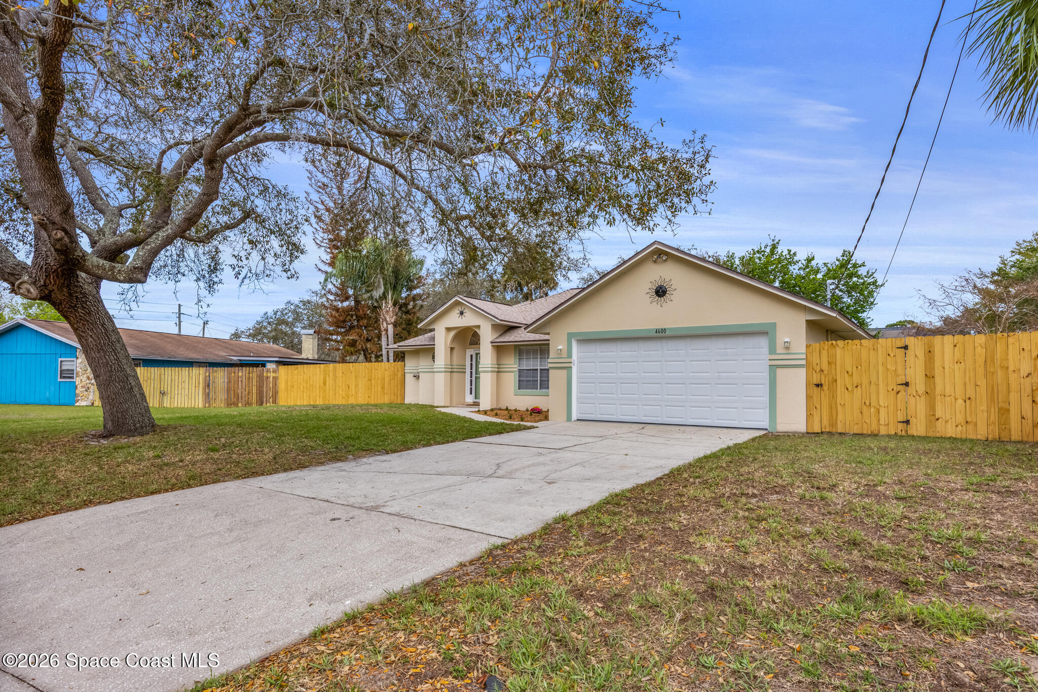 4600 Comfort Street Cocoa, FL 32927 - Photo 2 of 29 a front view of a house with yard and tree