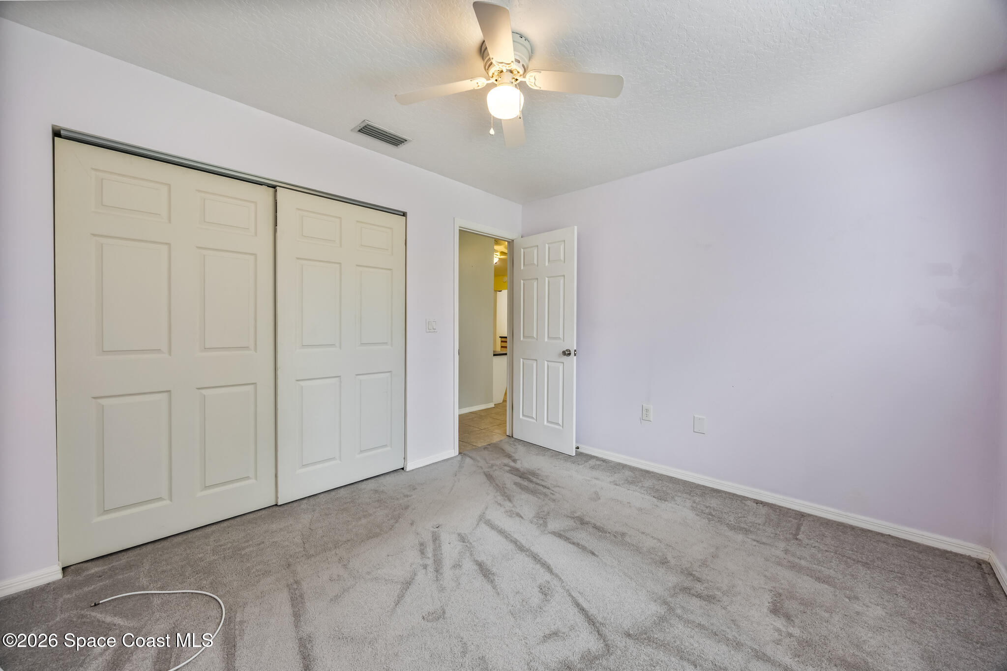 4600 Comfort Street Cocoa, FL 32927 - Photo 21 of 29 an empty room with closet and a ceiling fan
