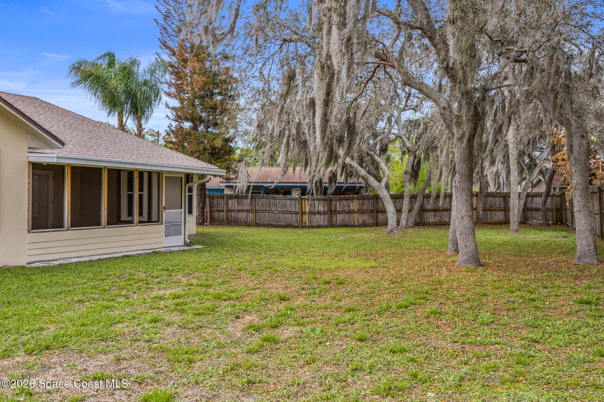 4600 Comfort Street Cocoa, FL 32927 - Photo 24 of 29 a view of a house with backyard and tree