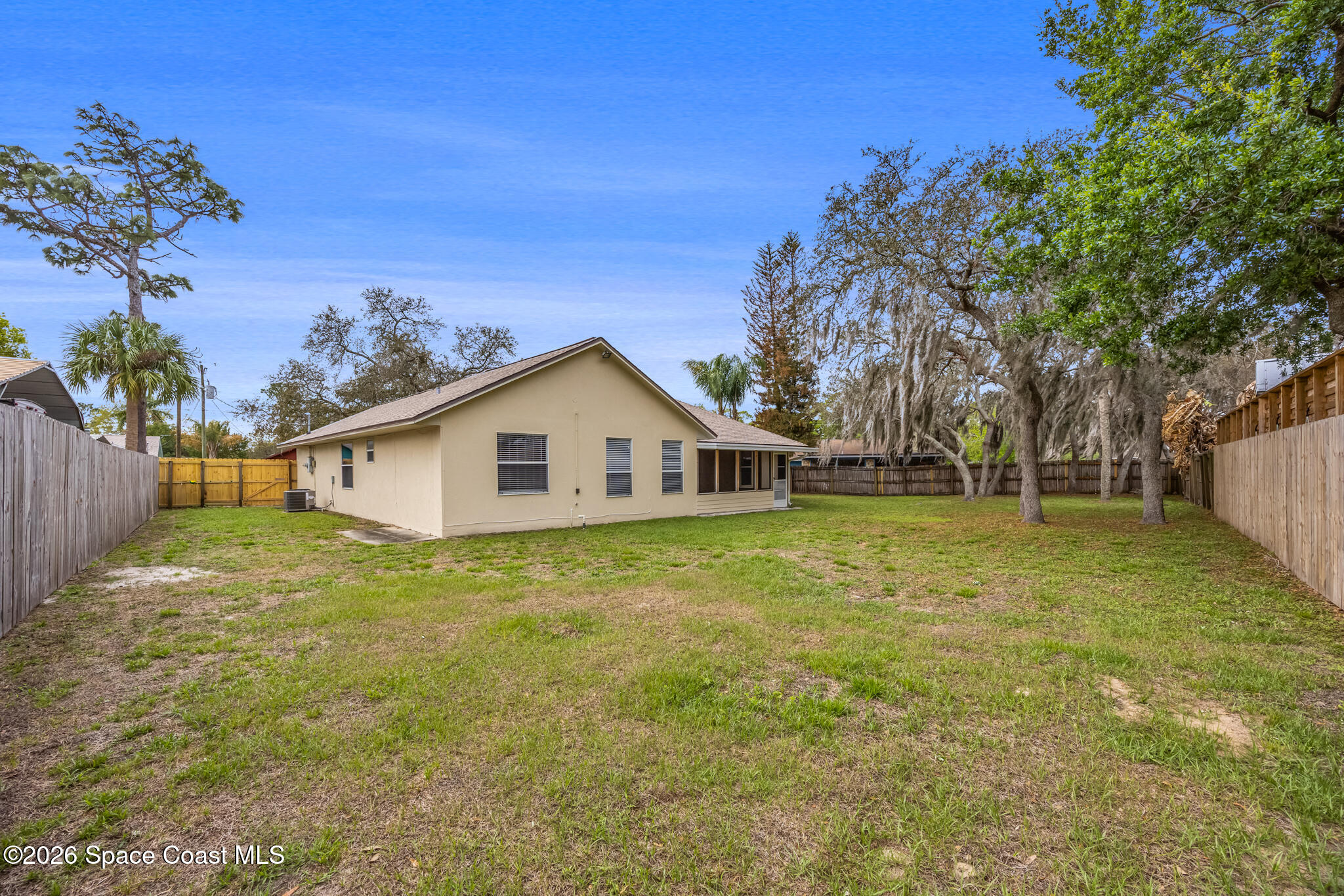 4600 Comfort Street Cocoa, FL 32927 - Photo 25 of 29 a view of a house with a yard
