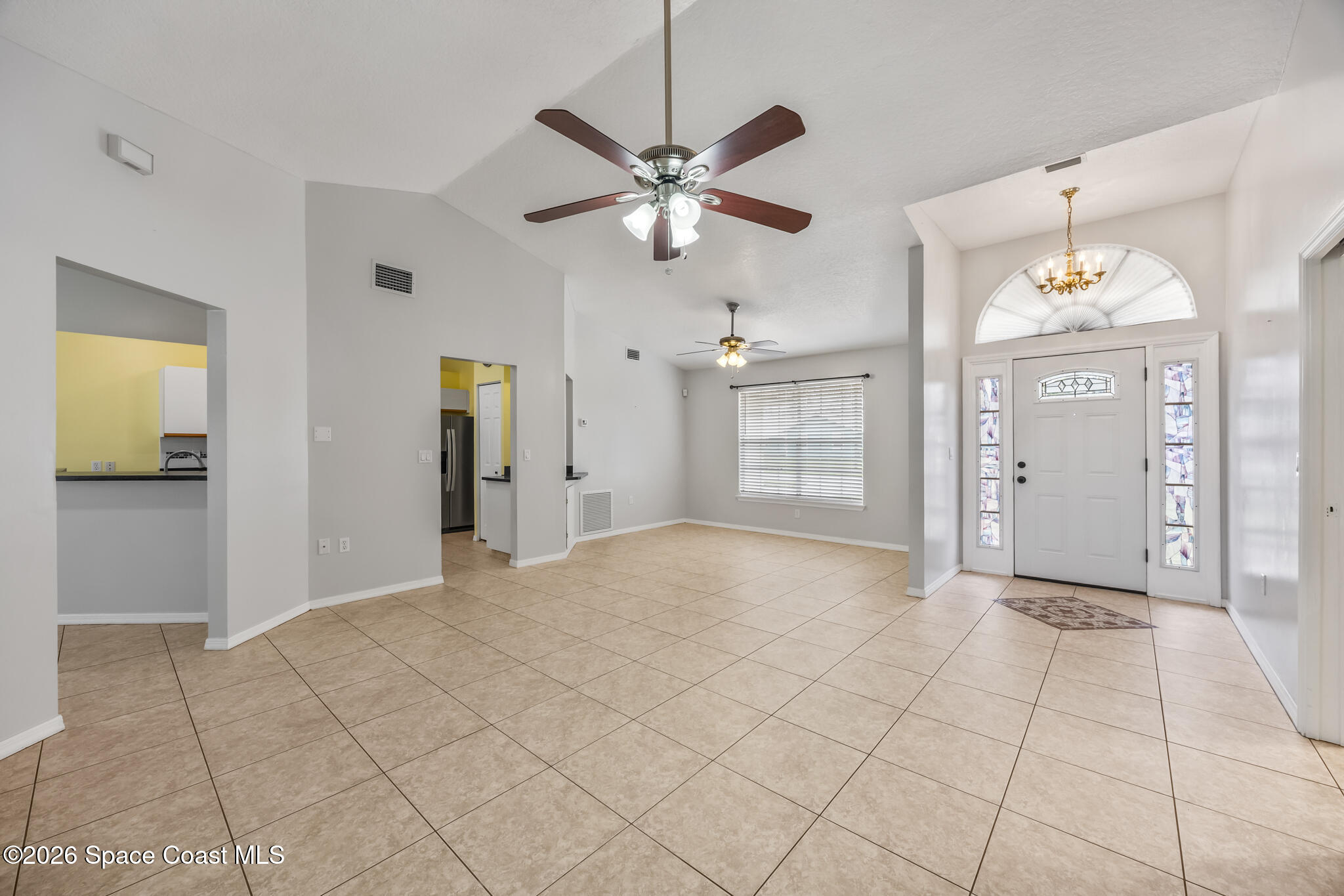 4600 Comfort Street Cocoa, FL 32927 - Photo 3 of 29 a view of a livingroom with a chandelier fan and windows