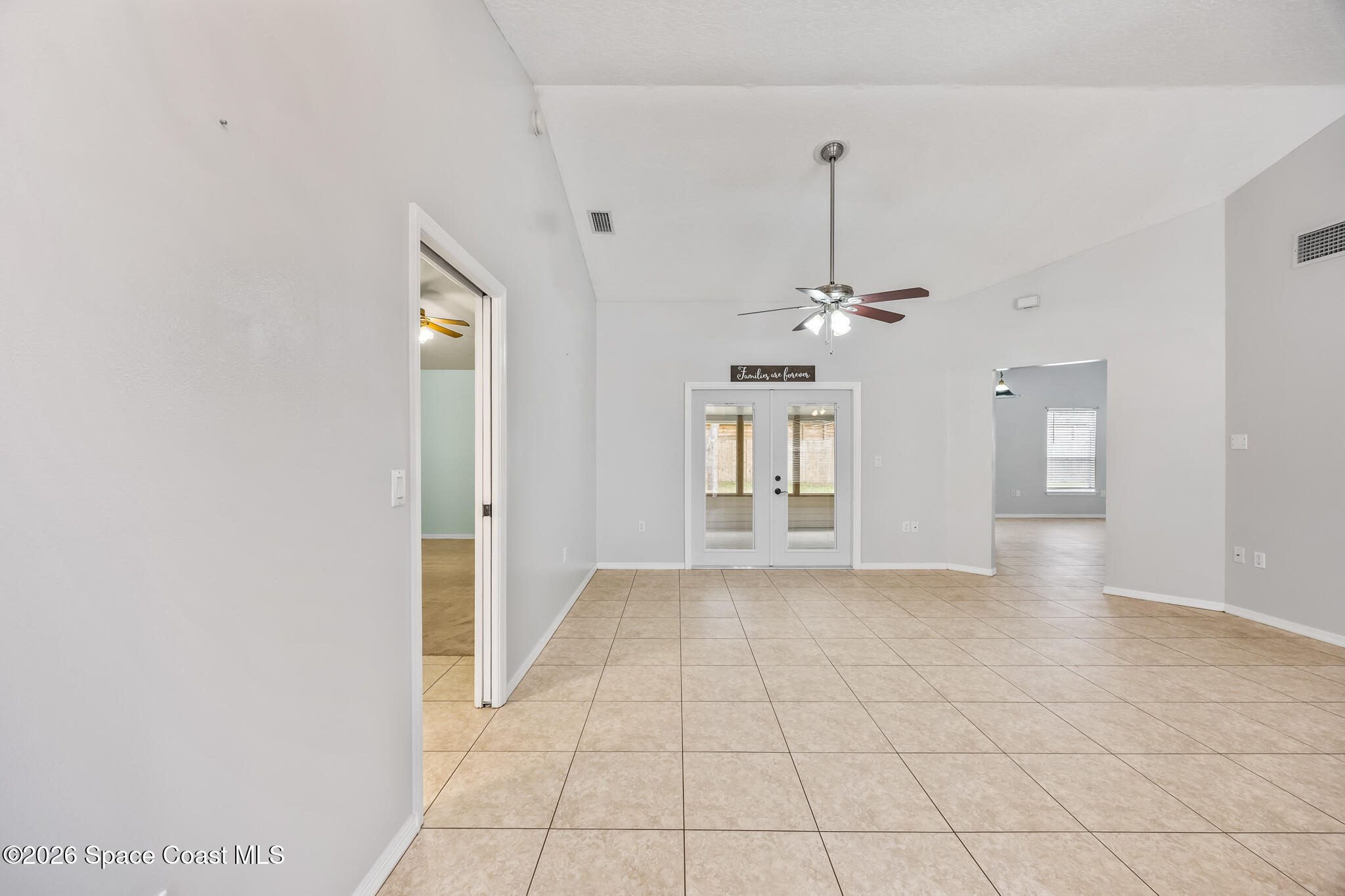 4600 Comfort Street Cocoa, FL 32927 - Photo 4 of 29 a view of a room with a chandelier fan and windows