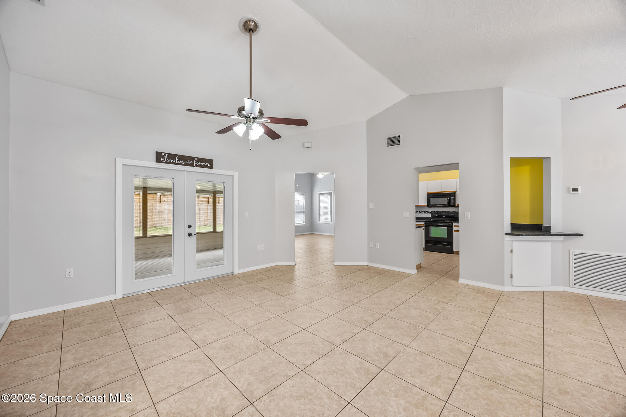 4600 Comfort Street Cocoa, FL 32927 - Photo 5 of 29 a view of an empty room with window and cabinet