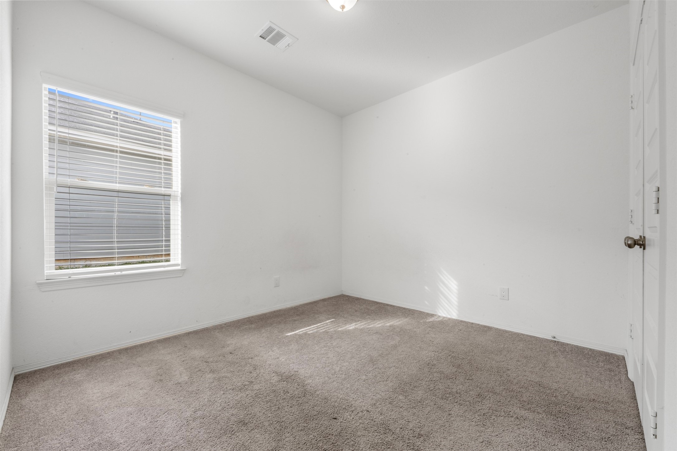 21214 George Vancouver Court Porter, TX 77365 - Photo 16 of 33 an empty room with a window