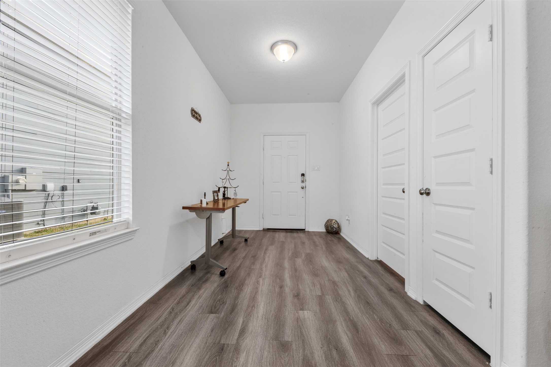 21214 George Vancouver Court Porter, TX 77365 - Photo 5 of 33 a view of a livingroom with wooden floor and a window