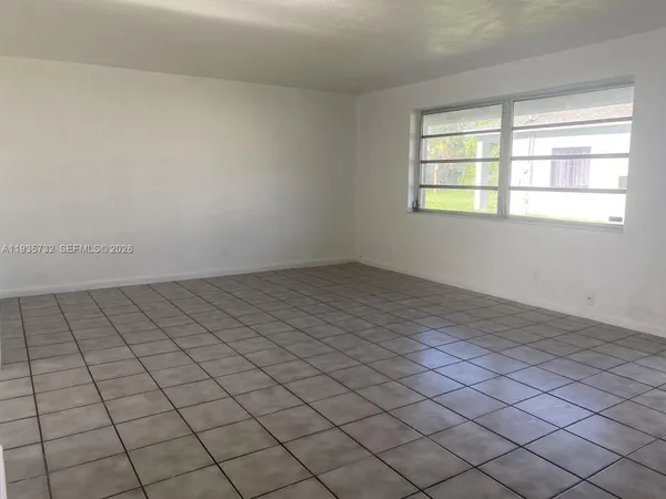 a view of an empty room and window