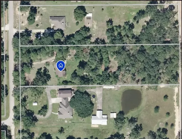 an aerial view of residential house with outdoor space