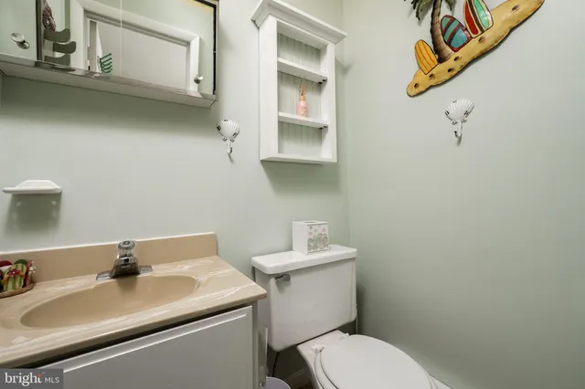 a bathroom with a sink toilet and vanity