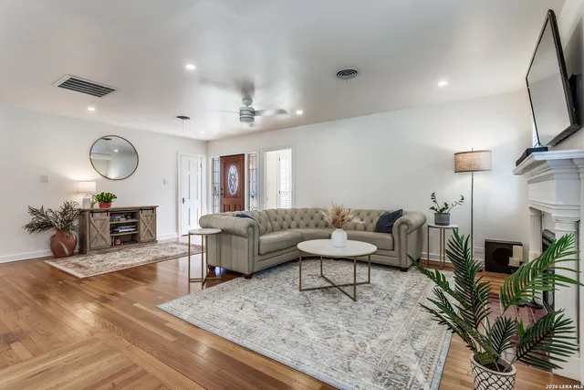 a living room with furniture and a fireplace