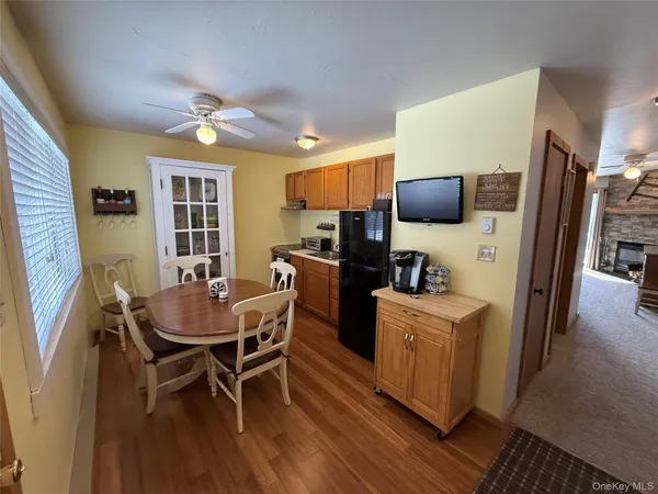 a view of a dining room with furniture window and wooden floor