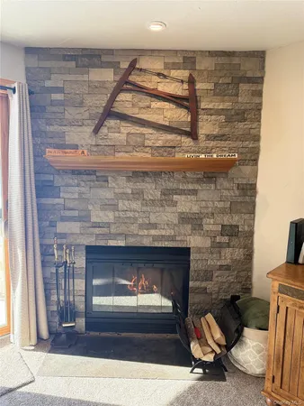 a fireplace with a vase on top of it