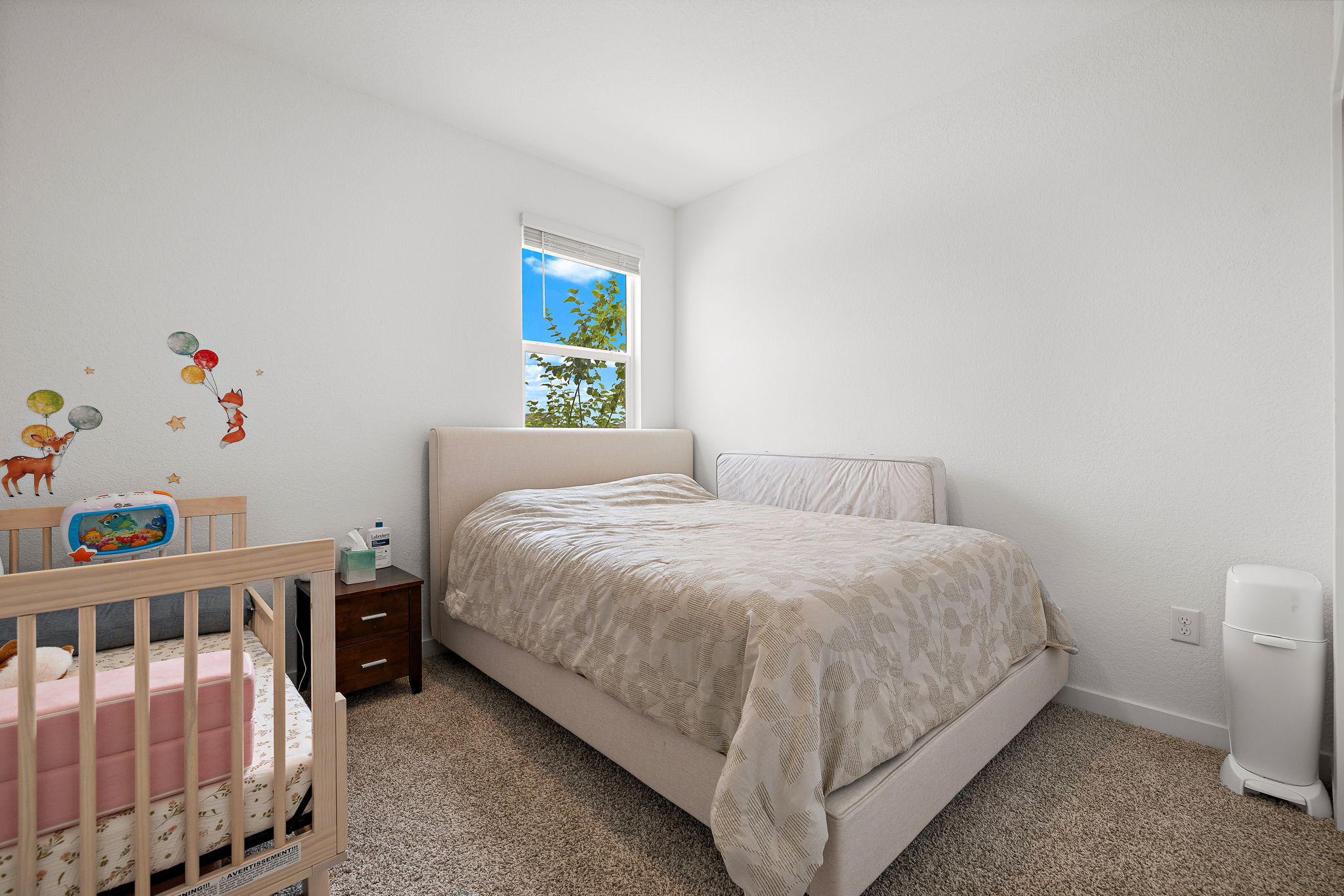 2313 Ranier Court Austin, TX 78754 - Photo 15 of 22 a bedroom with a bed and a window