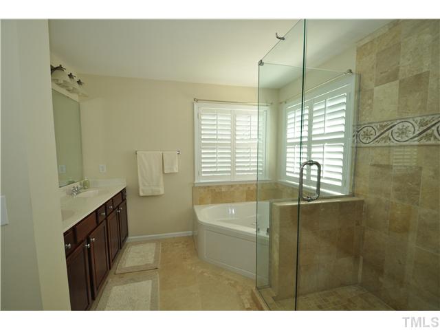 2109 Wide River Drive Raleigh, NC 27614 - Photo 11 of 20 a bathroom with a granite countertop sink a toilet a shower and a mirror